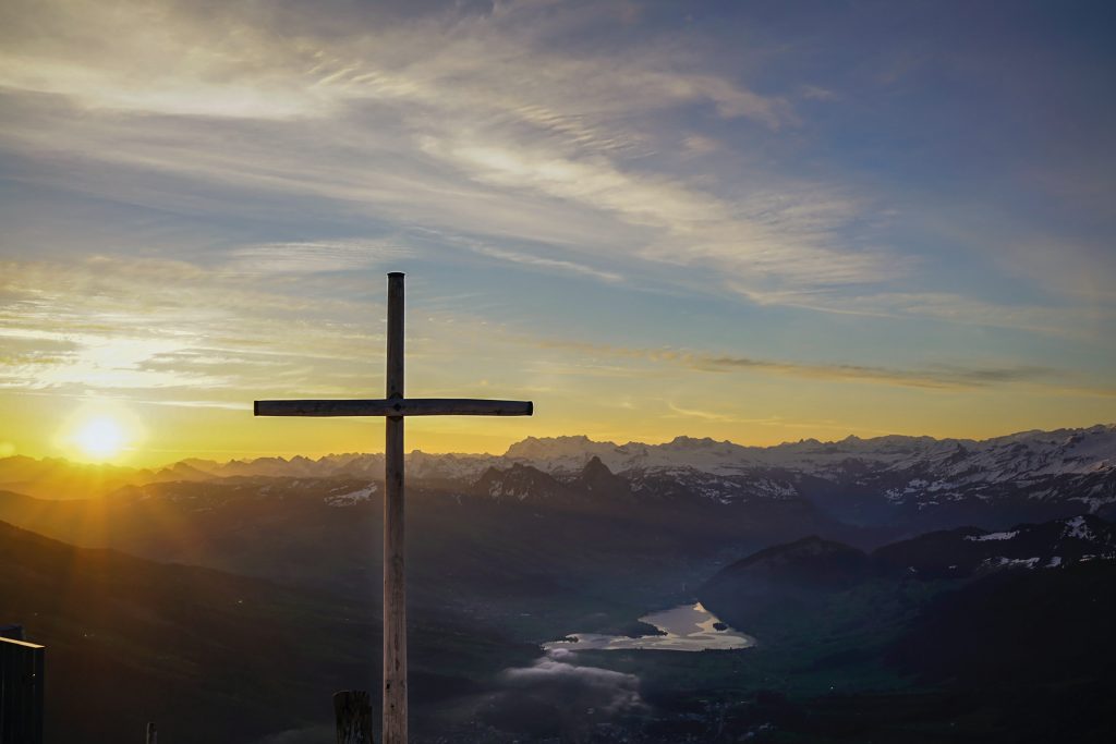 cross of Jesus over mountain